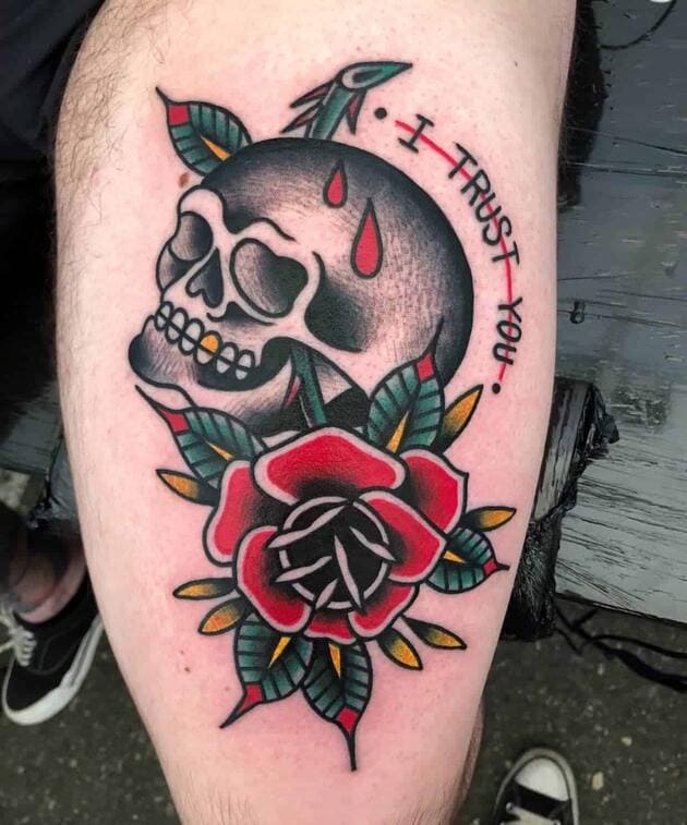 Traditional tattoo of a skull and a rose with the text i trust you.